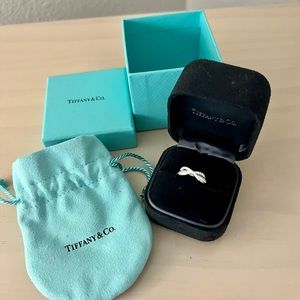 Brand new Tiffany & Co. Infinity Diamond Fashion Ring in 18k
White Gold 0.13 CTW